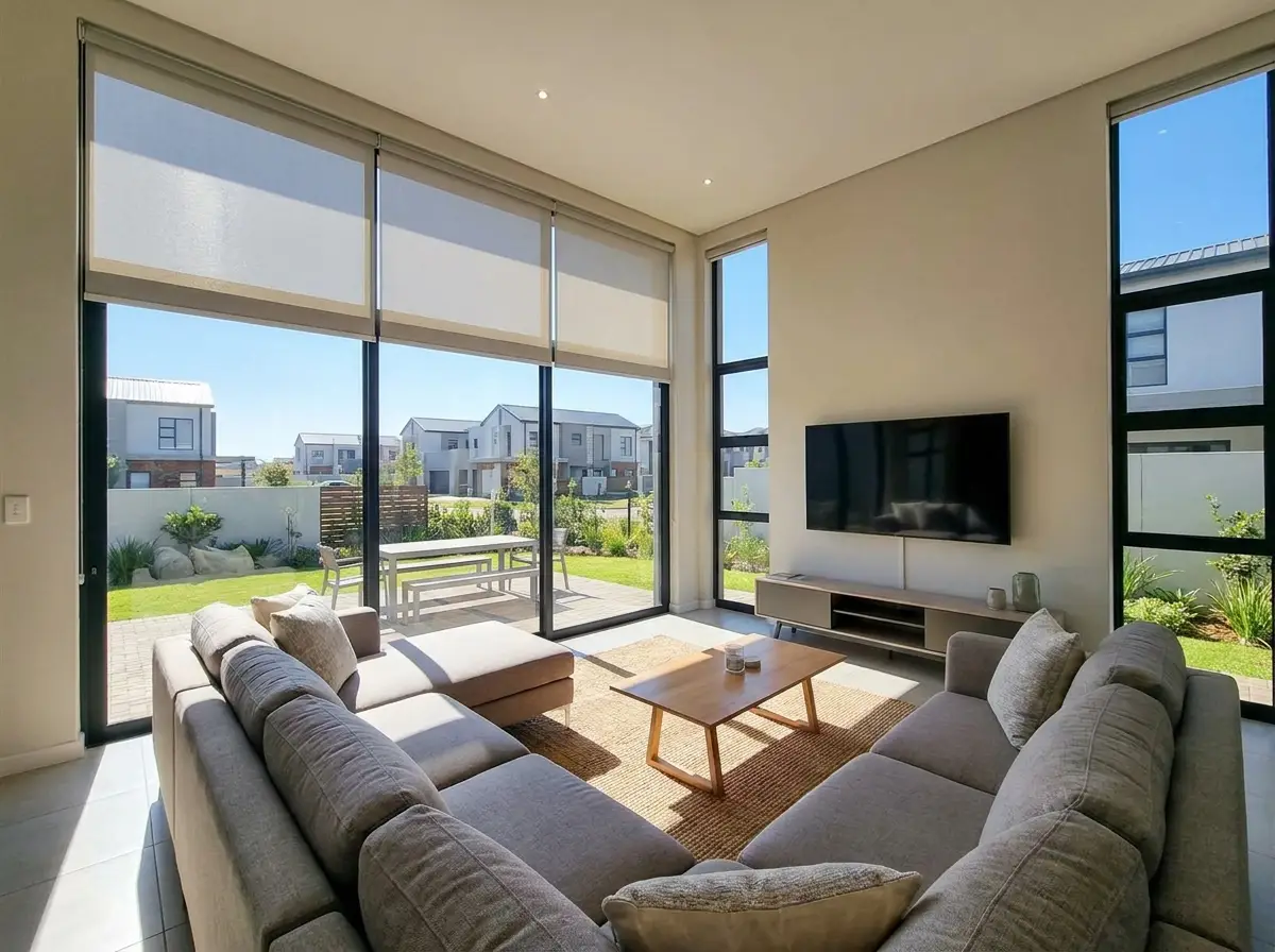 Interior of a new-build cluster estate living room in Raslouw with a motorised roller blind